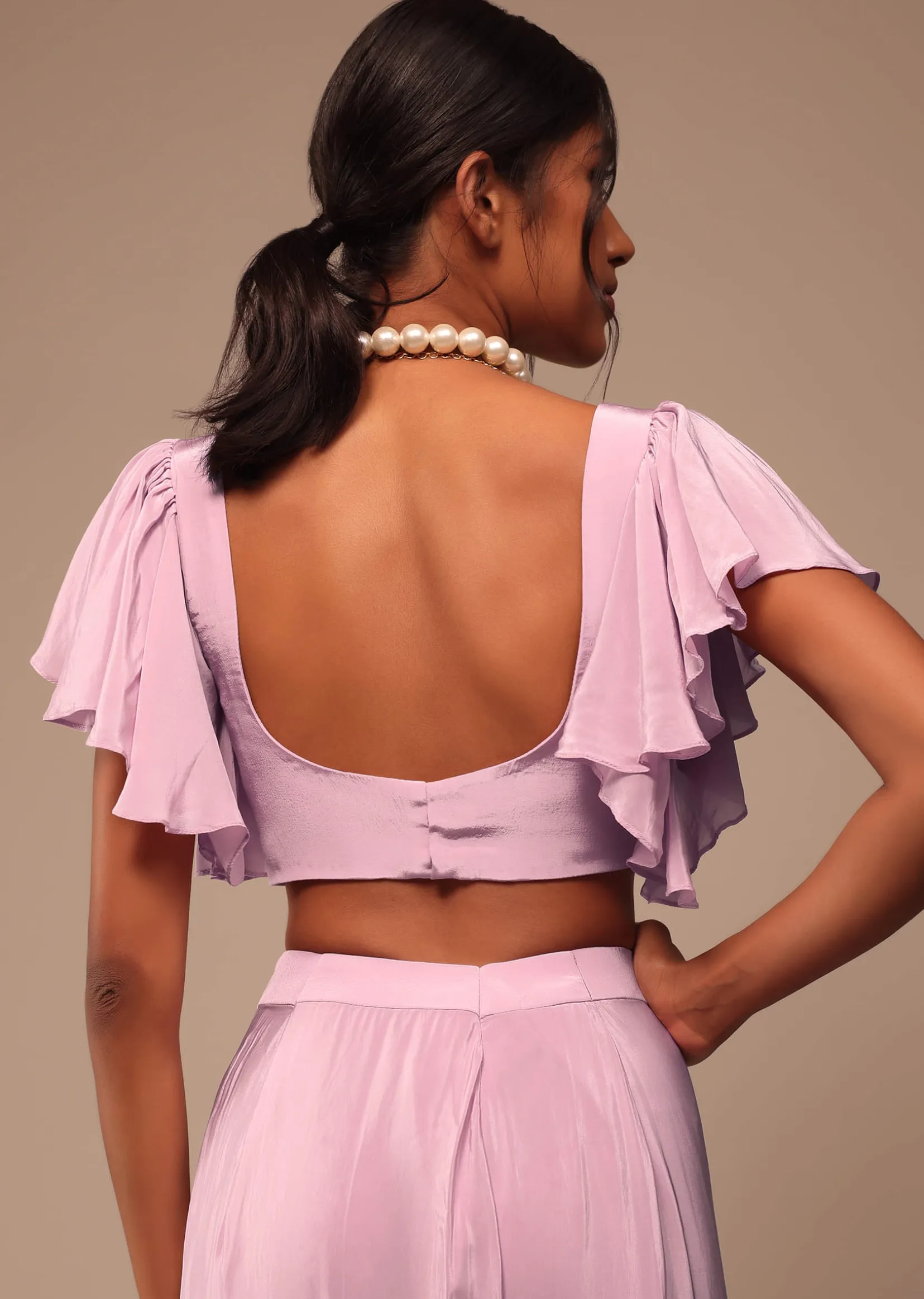 Baby Pink Crepe Saree With Fancy Bow Shaped Blouse And Belt