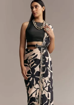 Beige Crepe Saree With Black Floral Print And Embellished Border