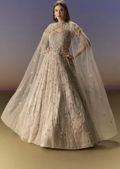 Beige Gown With Shoulder Cape And Rich Vertical Embroidery