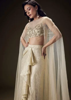Beige Zardozi Embroidered Blouse With Brocade Drape Skirt And Net Cape