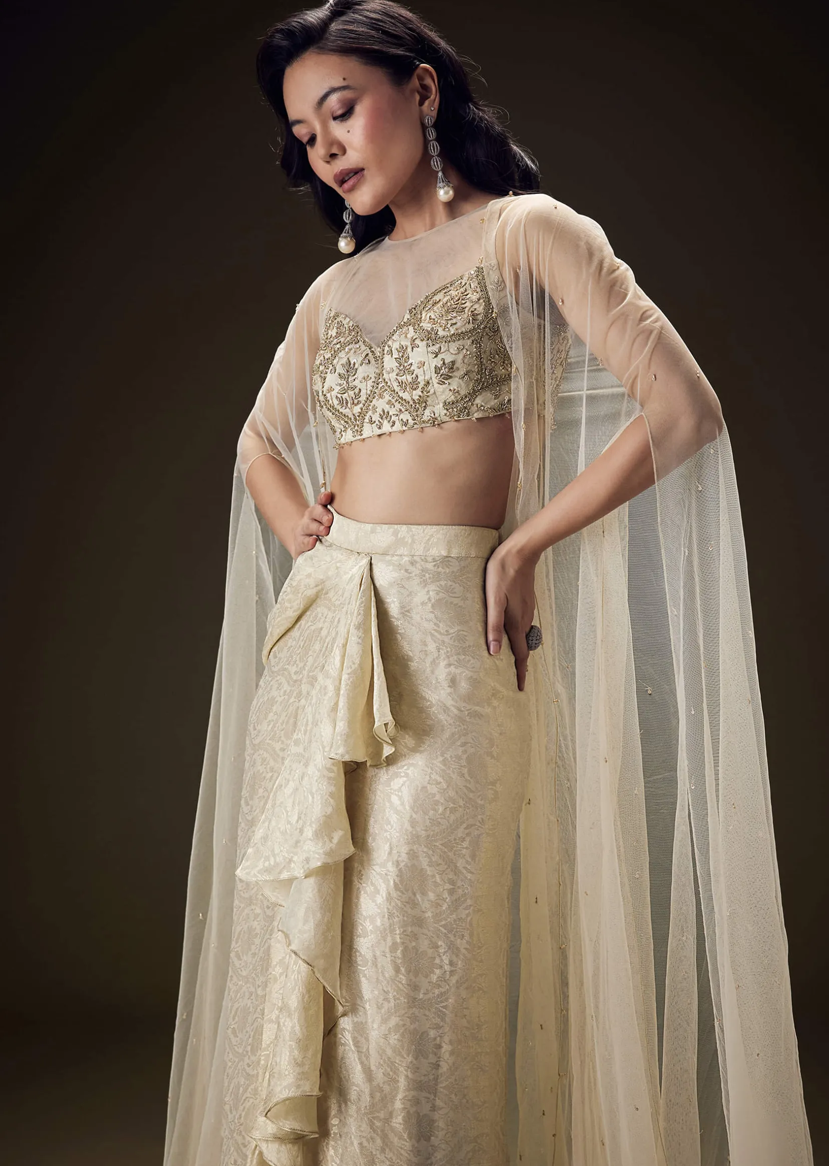 Beige Zardozi Embroidered Blouse With Brocade Drape Skirt And Net Cape