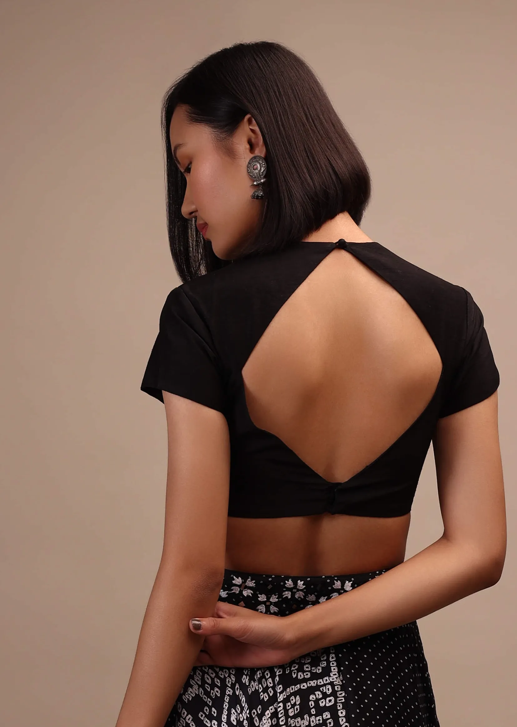 Black Cap Sleeves Blouse In The Round Neck. Raw Silk With Cut Out Back Neck And Hook Closure