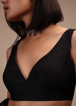 Black Sleeveless Blouse In A Sweetheart Neck Line Straight Hem Line With Back Zip Closure