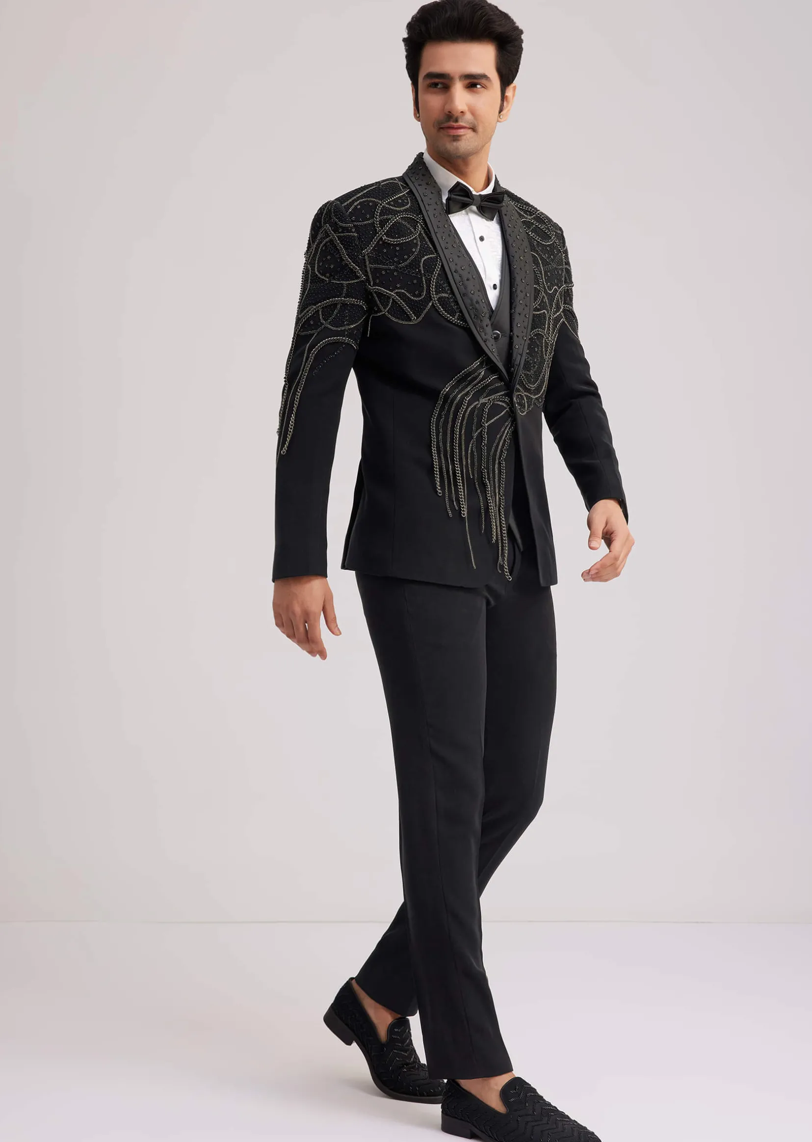 Black Suiting Tuxedo With Metallic Chain And Stone Work