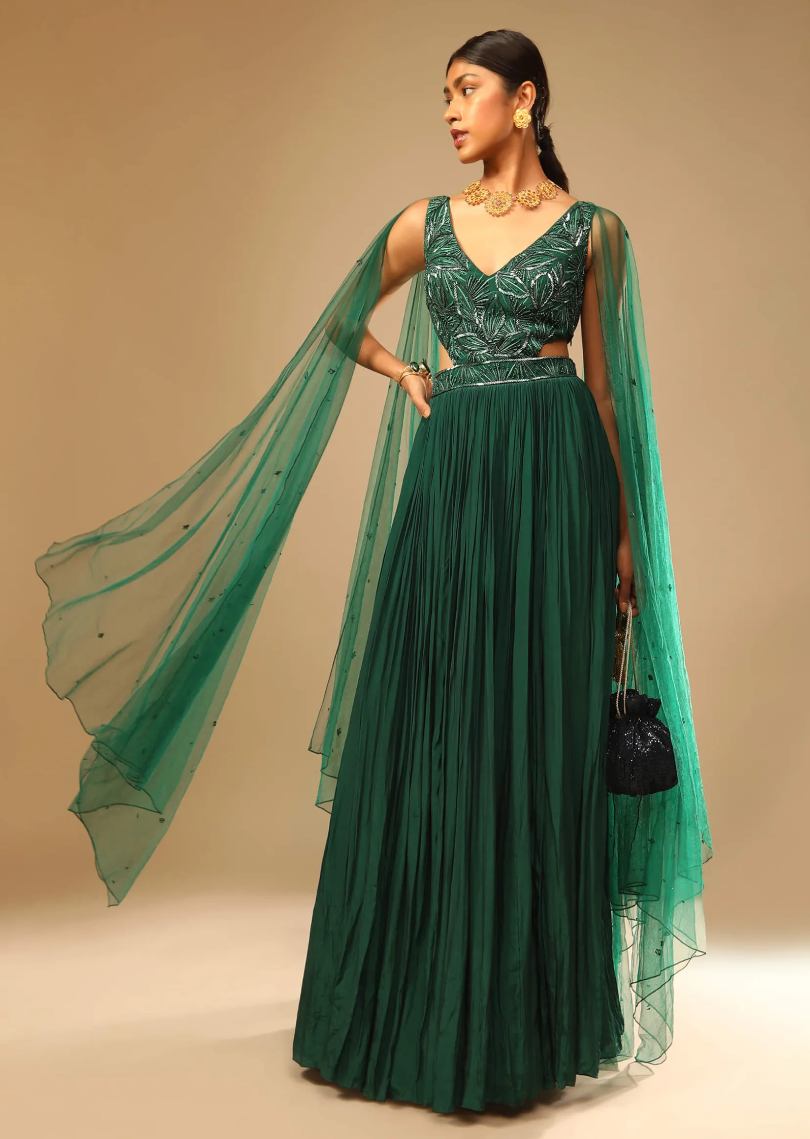 Bottle Green Gown In Crepe With Side Cut Outs In The Hand Embroidered Bodice