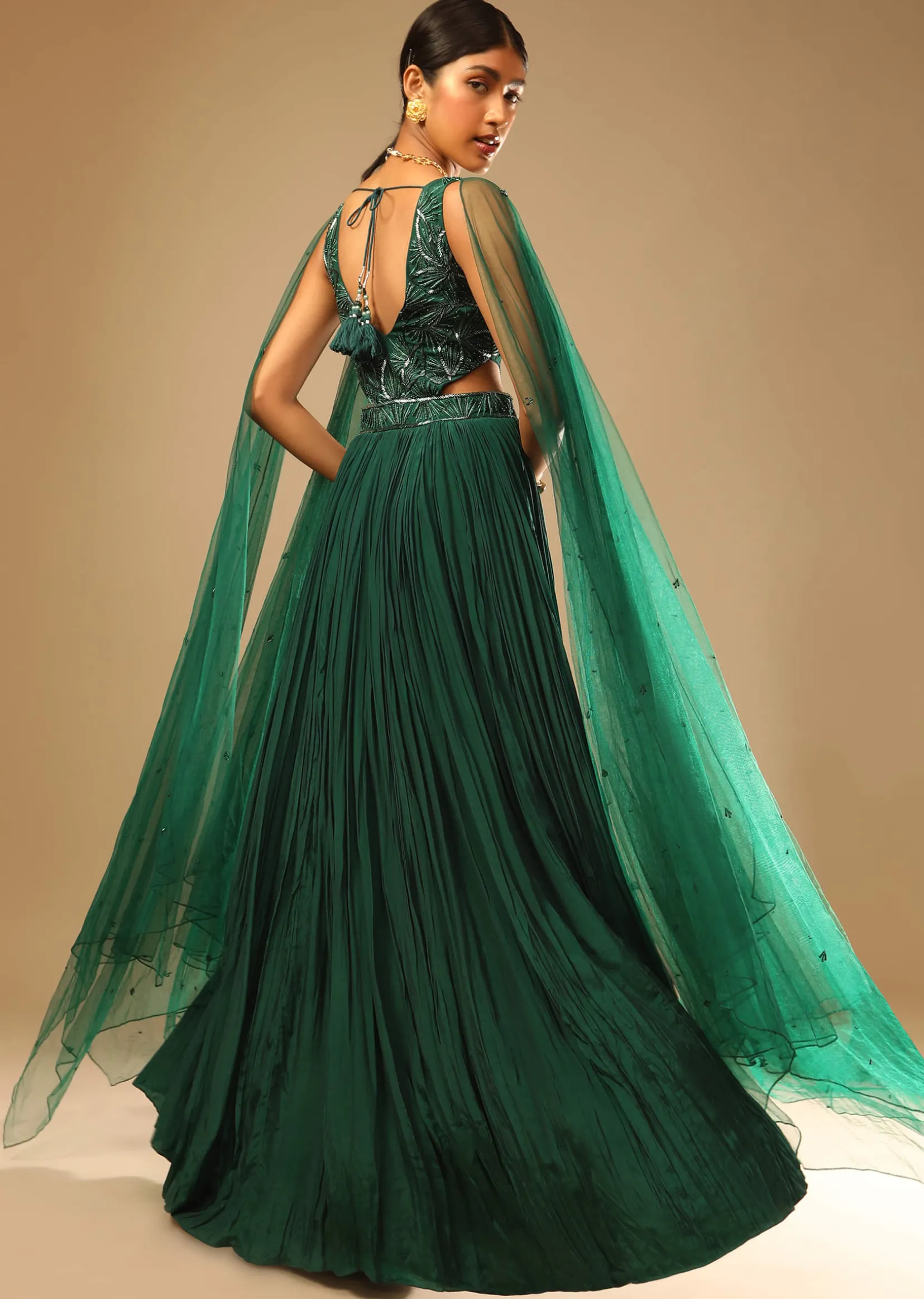 Bottle Green Gown In Crepe With Side Cut Outs In The Hand Embroidered Bodice