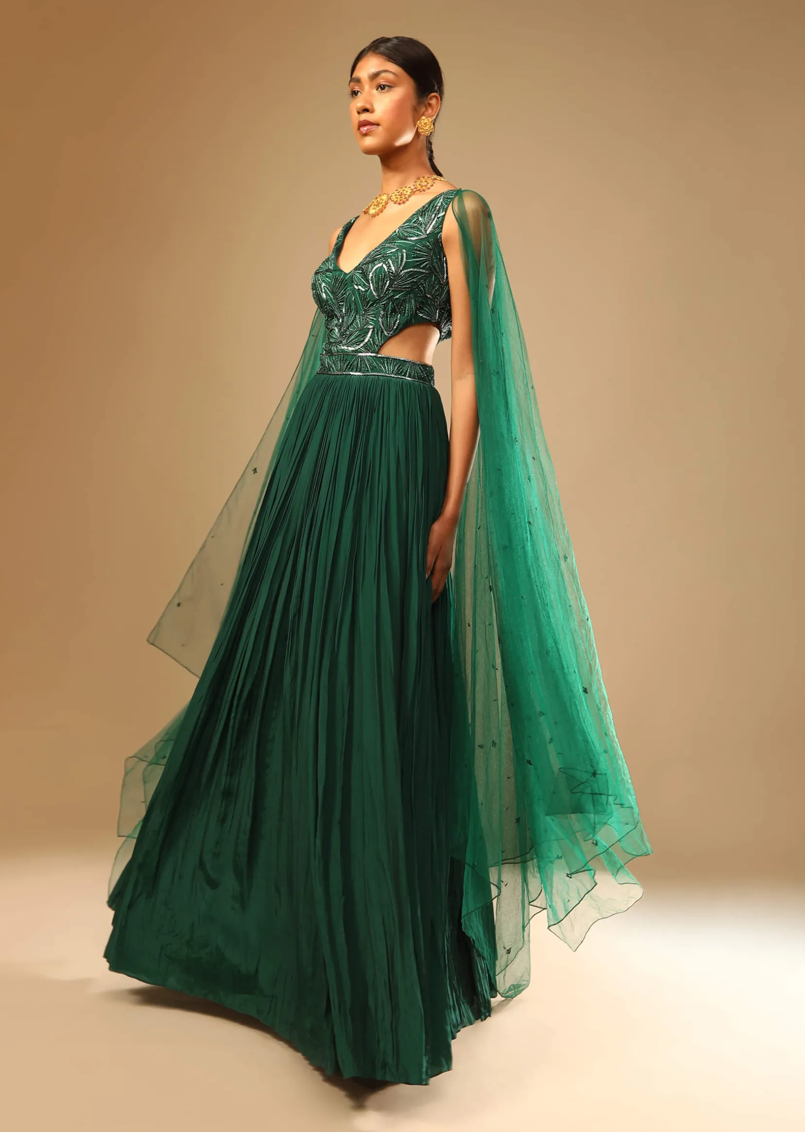 Bottle Green Gown In Crepe With Side Cut Outs In The Hand Embroidered Bodice