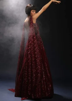 Burgundy Gown In Sequins Embellished Net With Attached Cape And Cut Dana Accented Front Cut Bodice