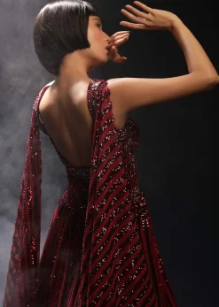 Burgundy Gown In Sequins Embellished Net With Attached Cape And Cut Dana Accented Front Cut Bodice