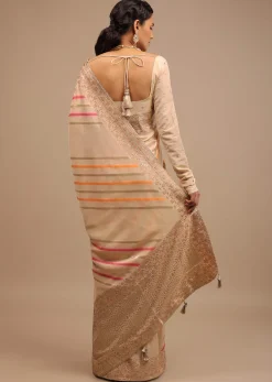 Cream Saree In Dola Silk With Multi Colored Woven Diagonal Stripes And Floral Border