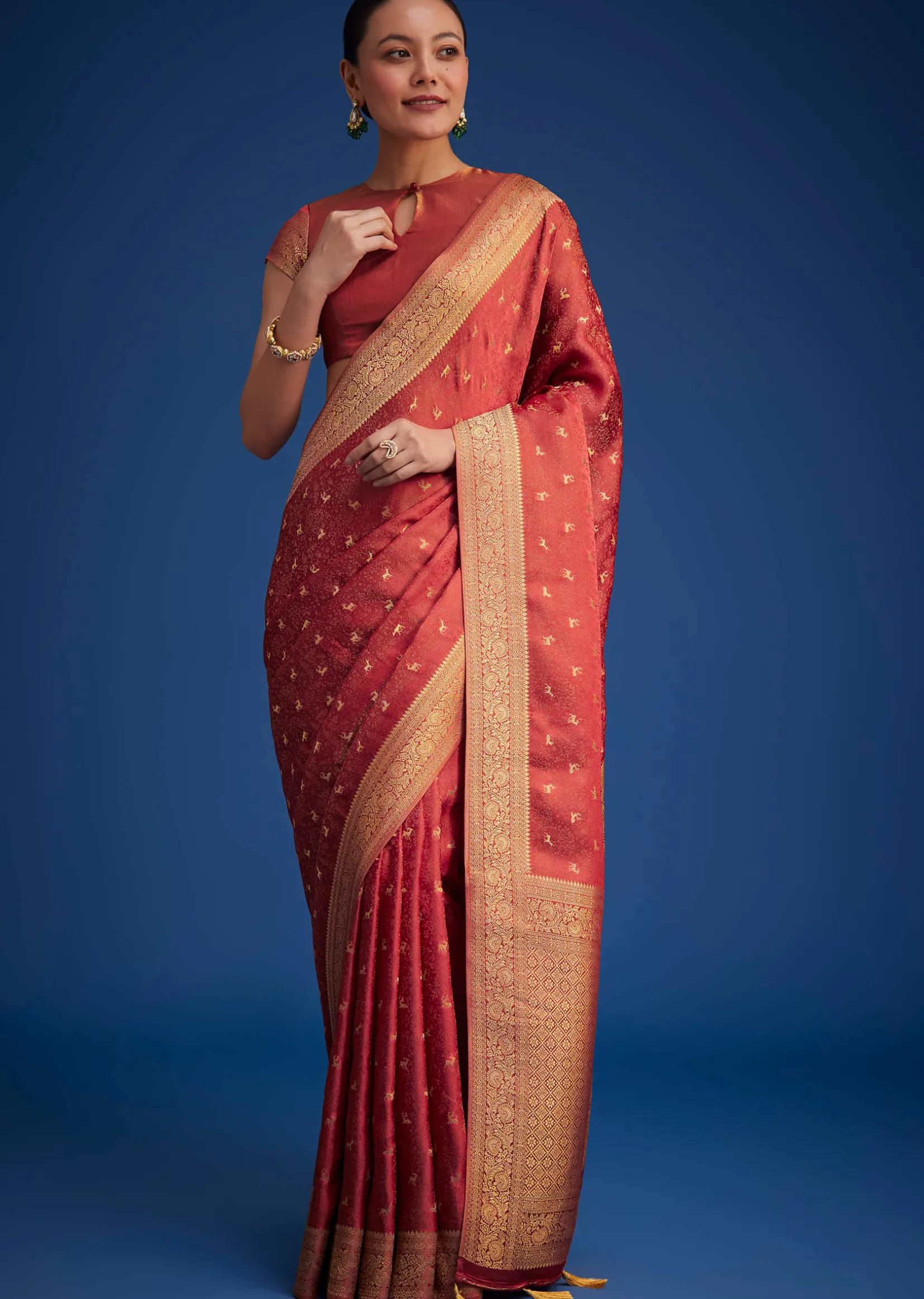 Dusky Orange Tissue Silk Saree With Zari Border And Butti Work