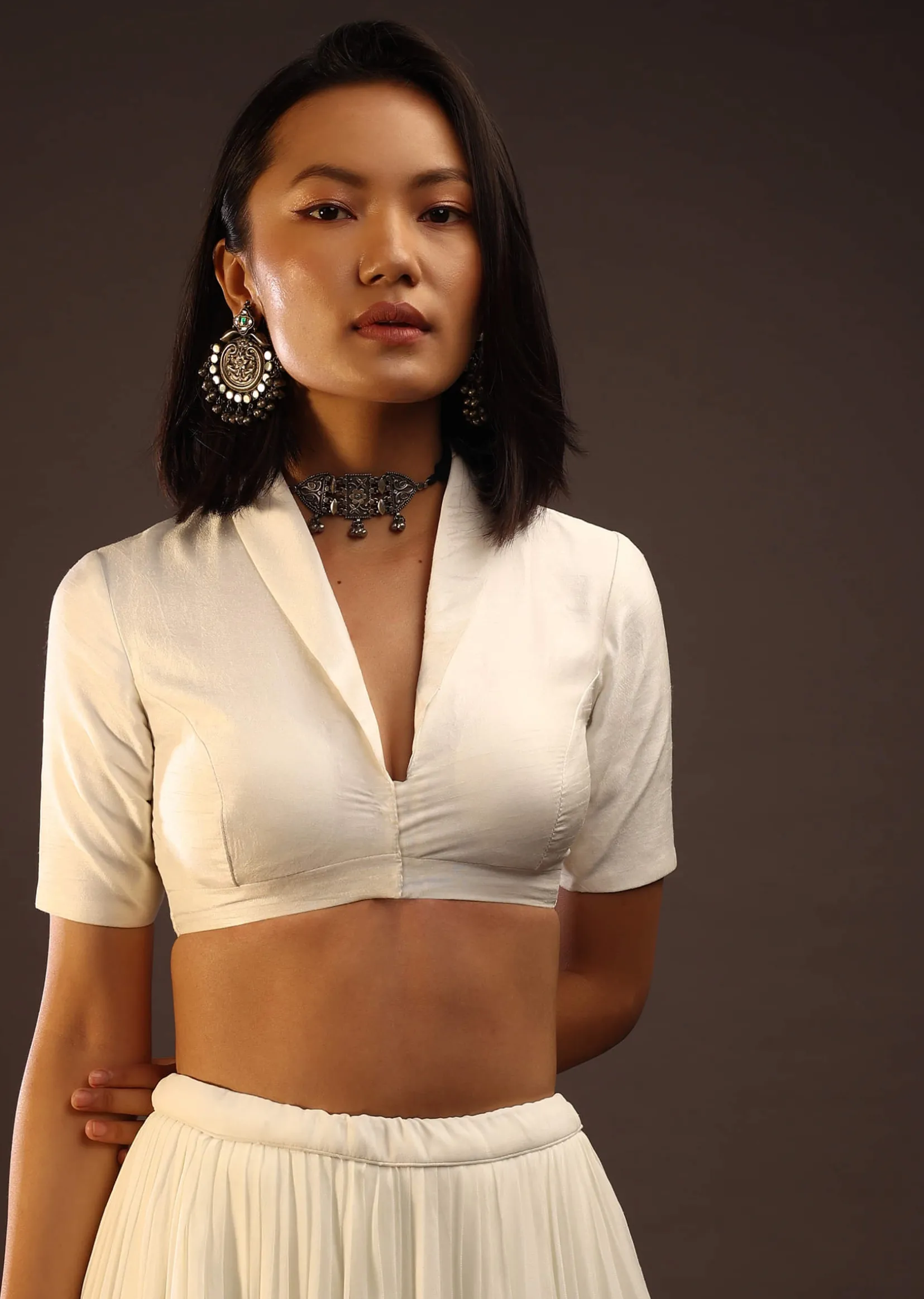Egret White Half-Sleeved Blouse With Long Collar Neckline. Front Hook Closure With A Straight Hemline.