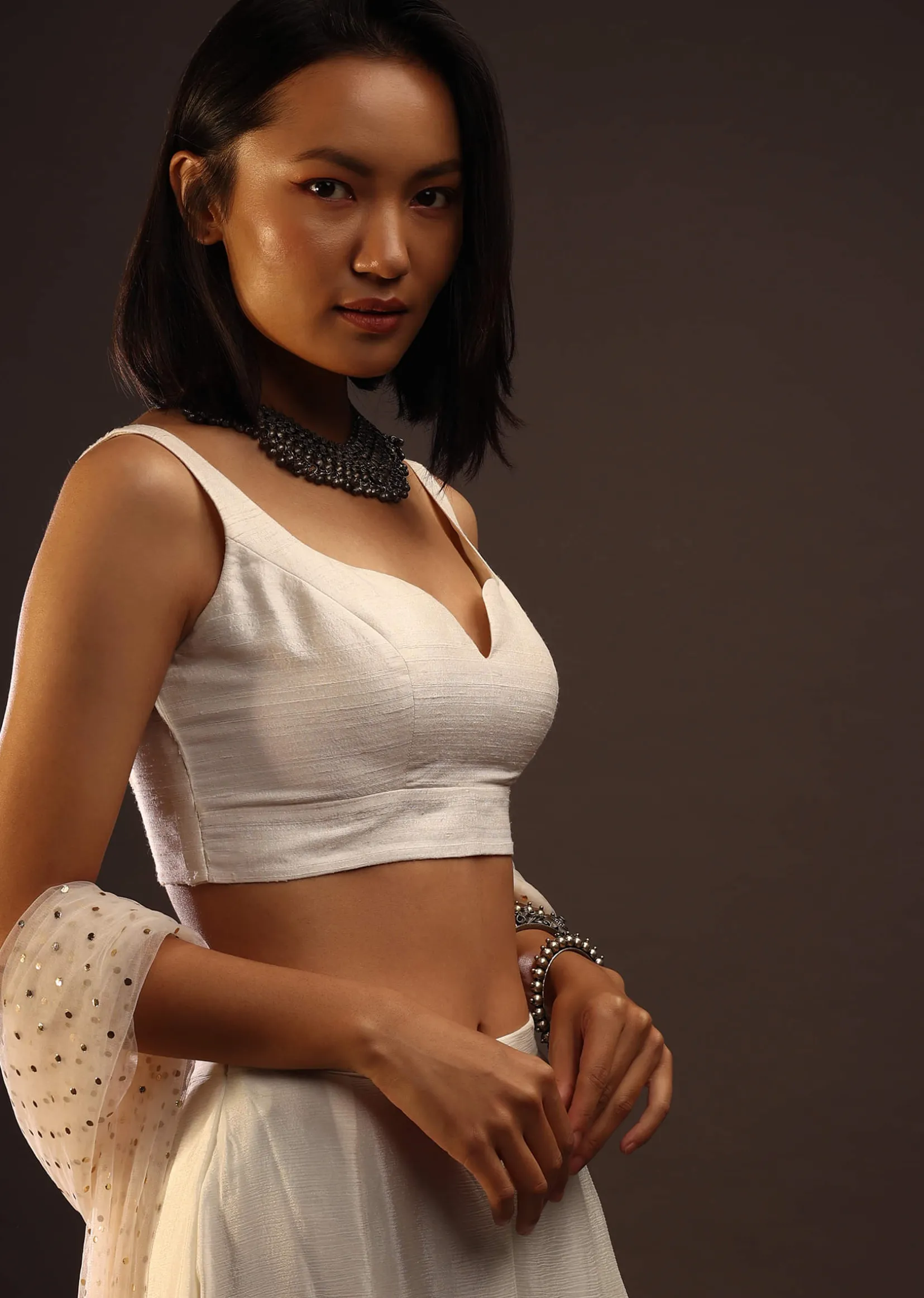 Egret White Sleeveless Blouse With A Sweetheart Neckline. Padded With A Back Hook Closure