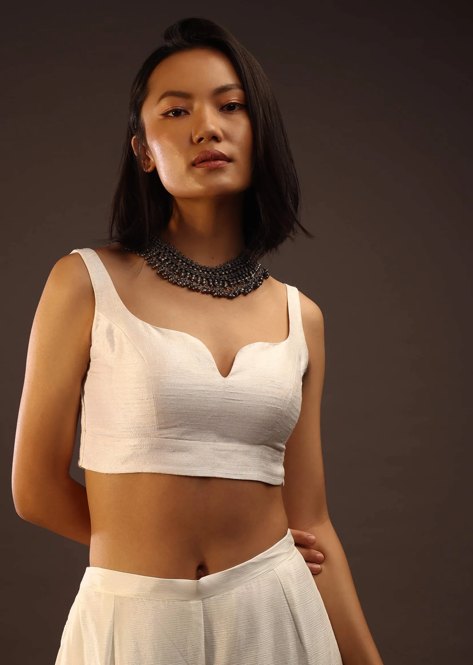 Egret White Sleeveless Blouse With A Sweetheart Neckline. Padded With A Back Hook Closure