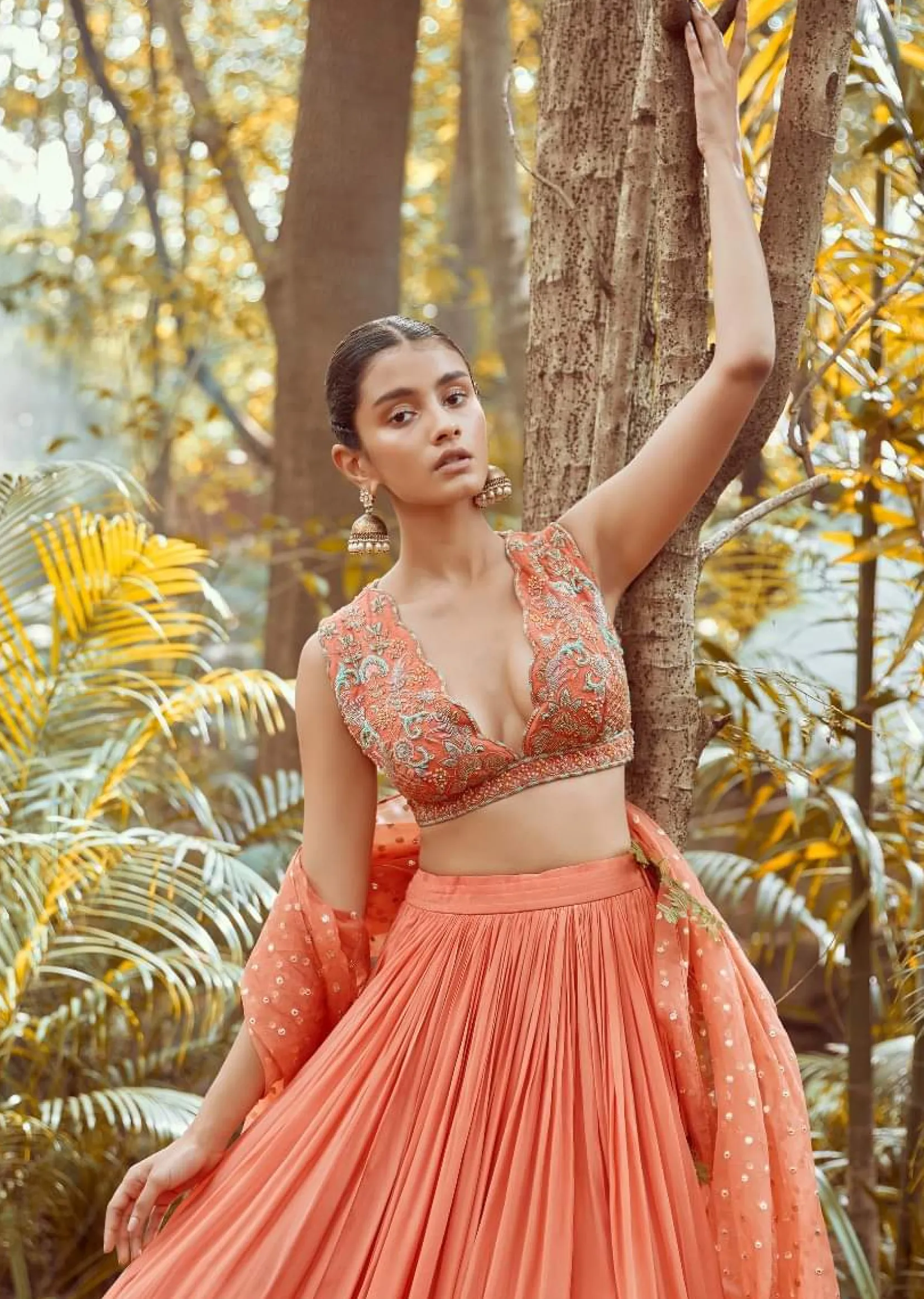 Fusion Coral Skirt In Crepe With Hand Embroidered Raw Silk Choli With Plunging Neckline