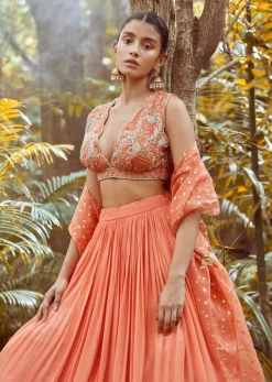 Fusion Coral Skirt In Crepe With Hand Embroidered Raw Silk Choli With Plunging Neckline