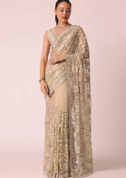 Gold Net Saree With Stone Studded And Floral work And Unstitched Blouse Piece