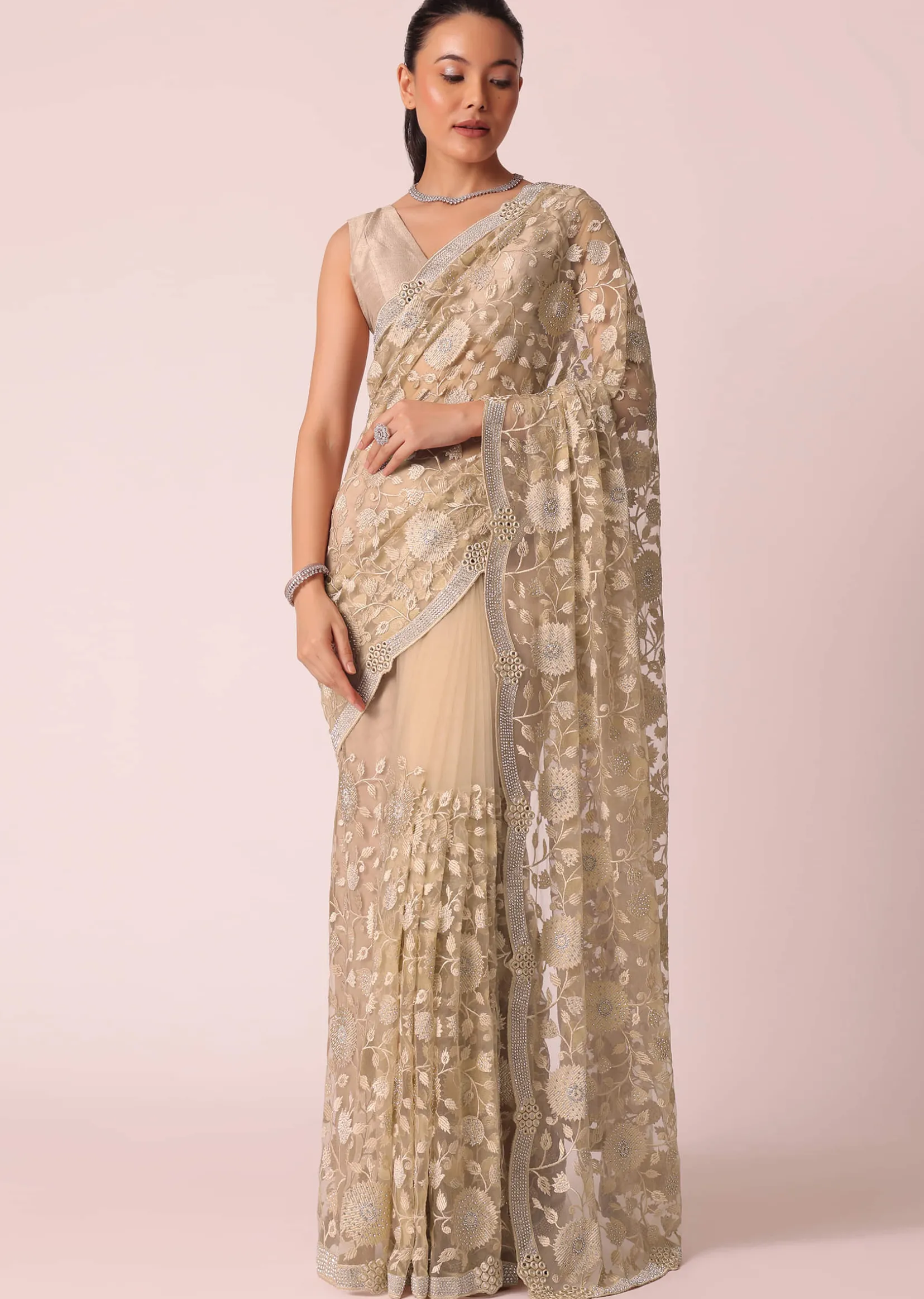Gold Net Saree With Stone Studded And Floral work And Unstitched Blouse Piece