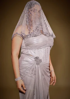 Gold One Shoulder Drape Gown With Embroidered Floral Brooch And Trail