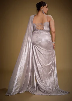 Gold One Shoulder Drape Gown With Embroidered Floral Brooch And Trail