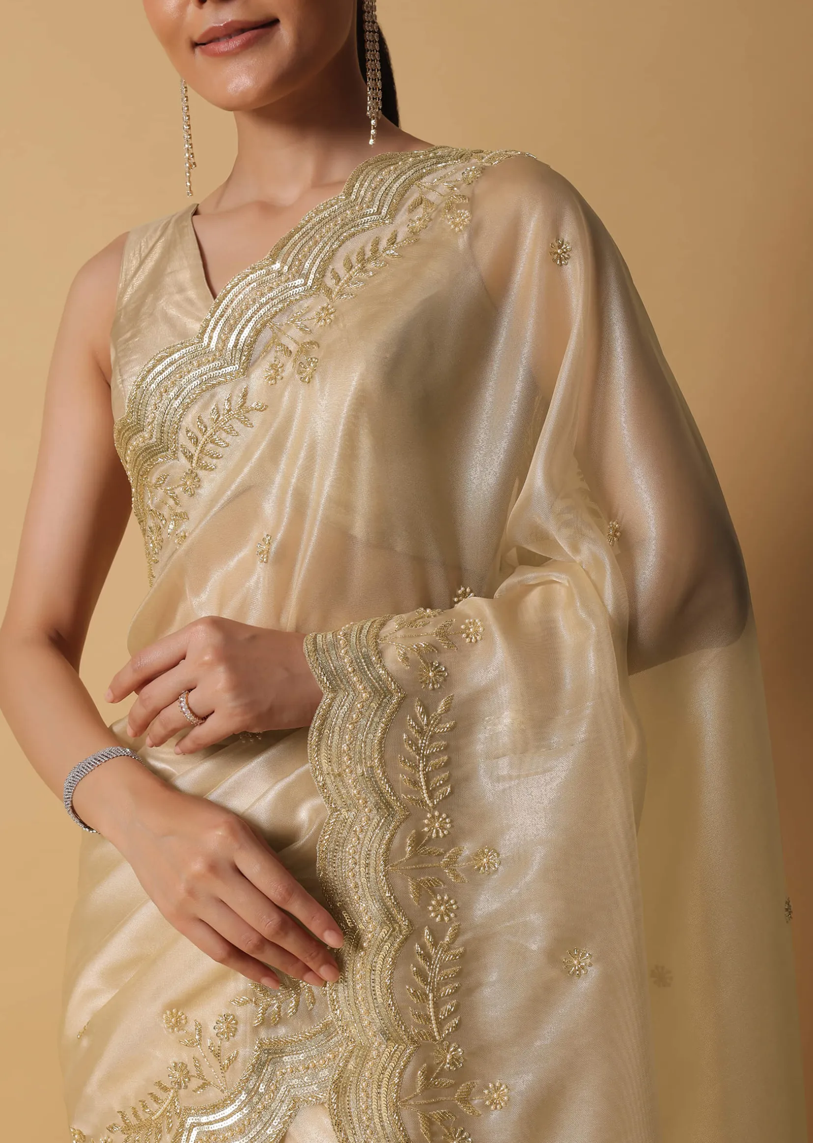 Gold Toned Foil Saree Fabricated In Tissue With Cut Dana Embellished Borders