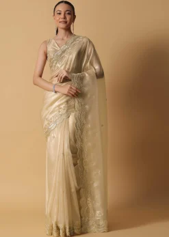 Gold Toned Foil Saree Fabricated In Tissue With Cut Dana Embellished Borders