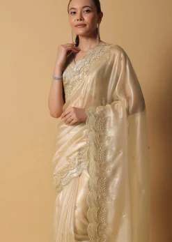 Gold Toned Foil Saree Fabricated In Tissue With Cut Dana Embellished Borders