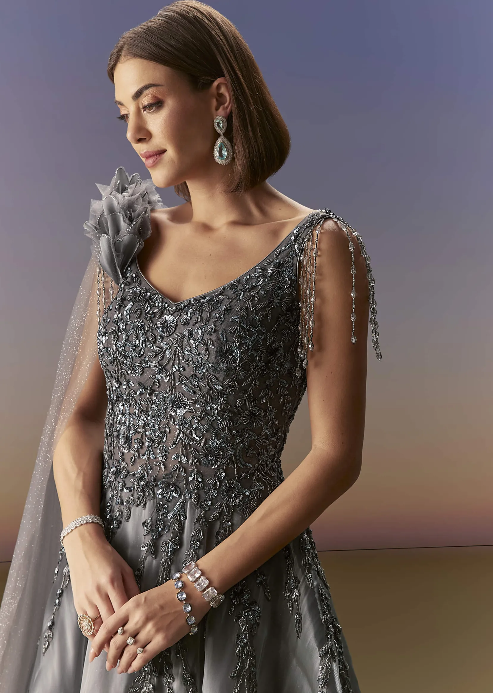 Grey Sleeveless Gown With Soft Net Trail And Shimmer