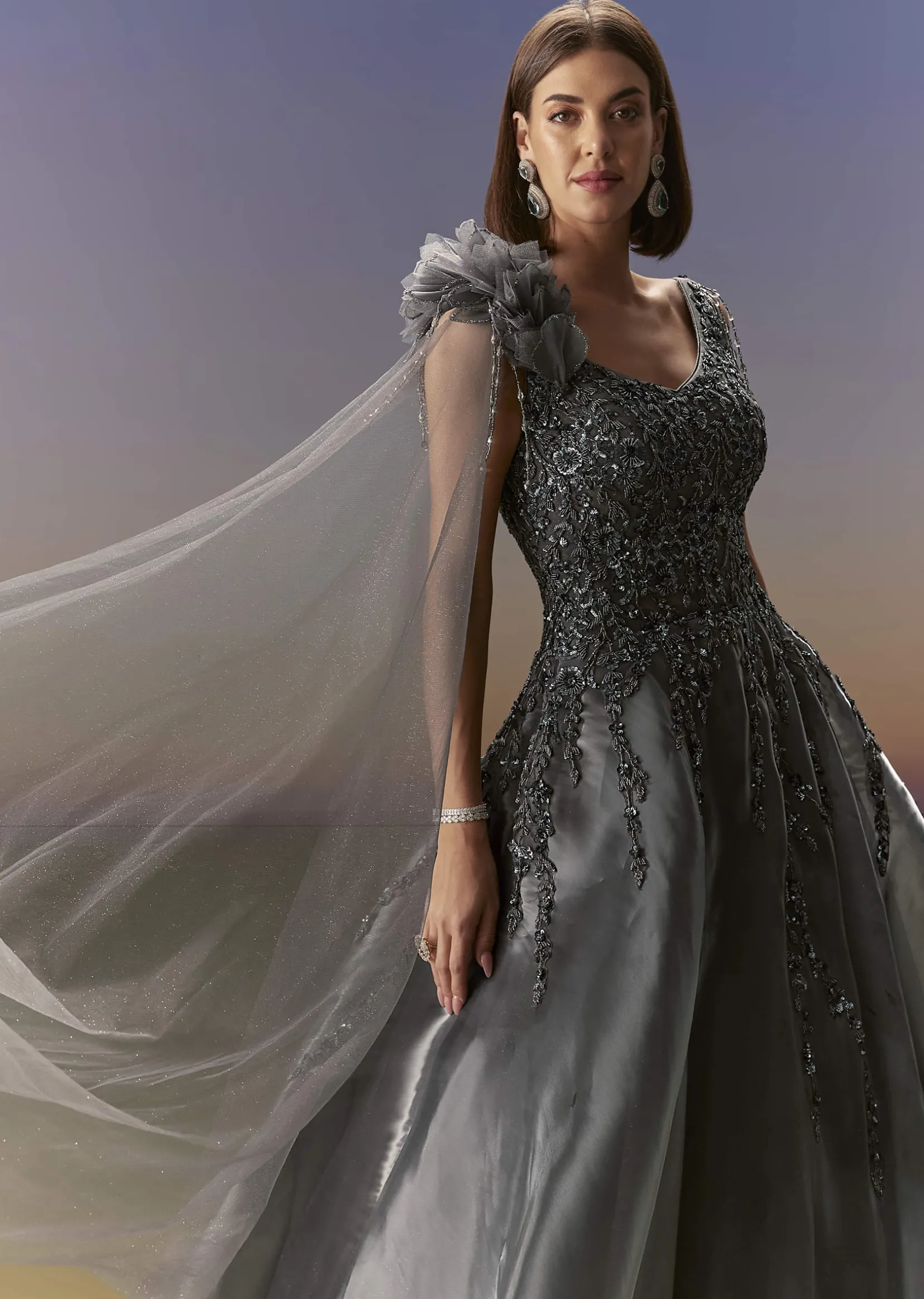 Grey Sleeveless Gown With Soft Net Trail And Shimmer