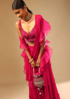 Hot Pink Crop Top Sharara Suit With An Attached Ruffle Draped And An Hand Embroidered Leaf Motifs