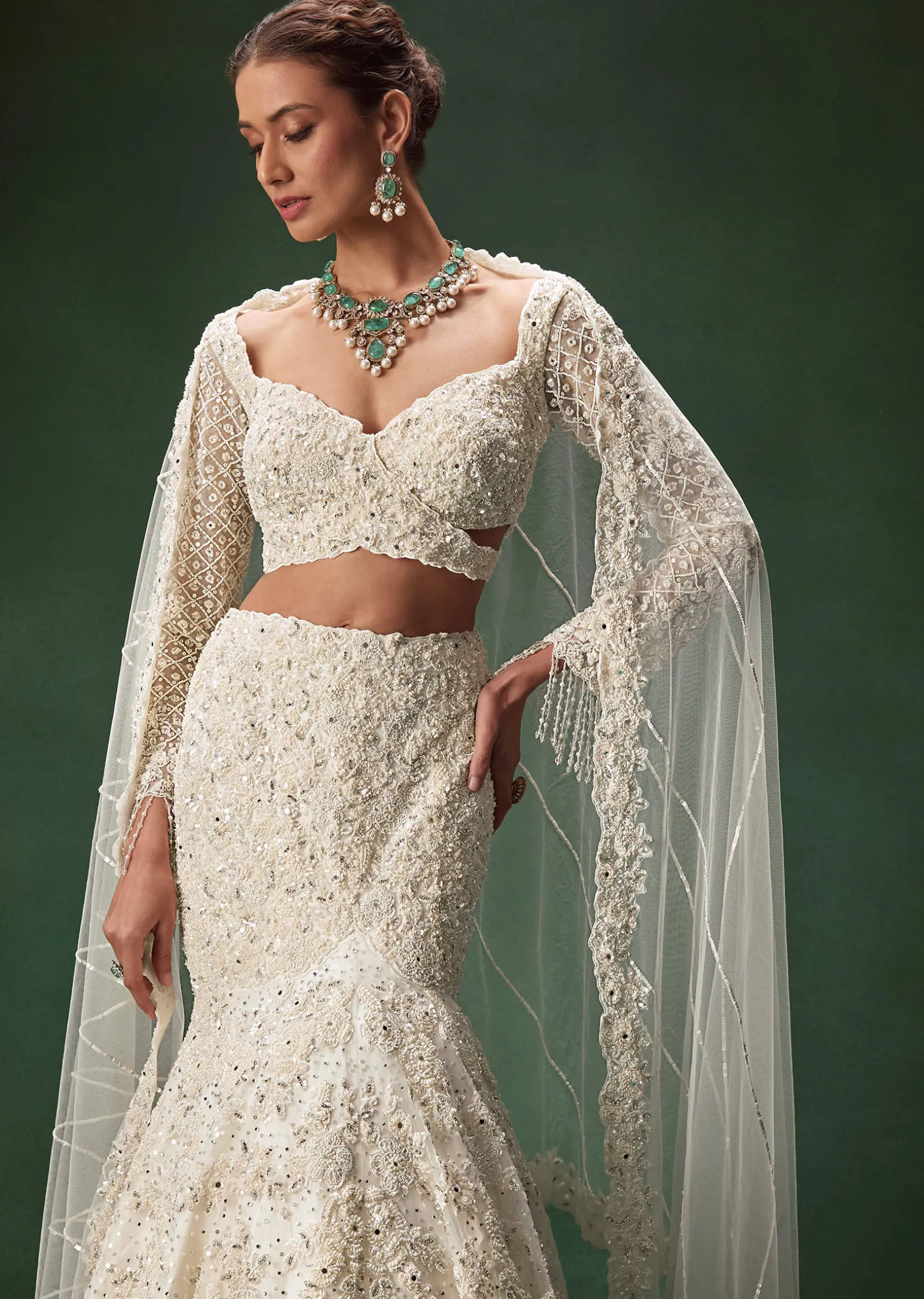 Ivory Mermaid Bridal Lehenga With Full Sleeves And Heavy Embroidery