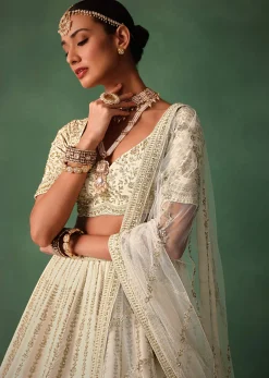 Ivory Raw Silk Hand Embroidered Lehenga Set In Cutdana Work