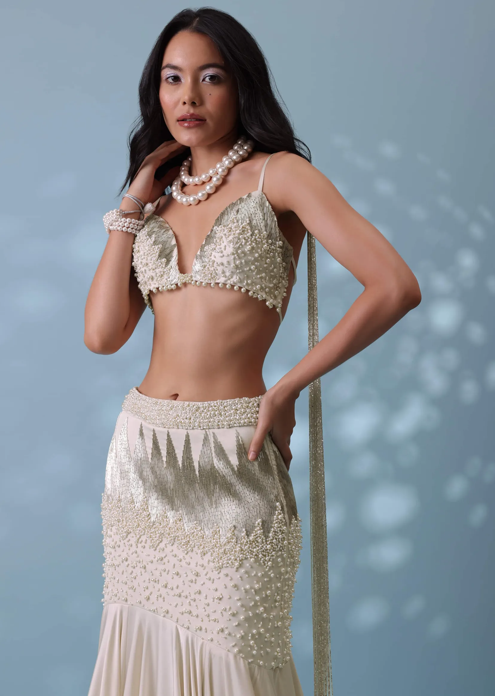 Ivory White Embroidered Trail Lehenga Set In Milano Satin With Tassel Blouse