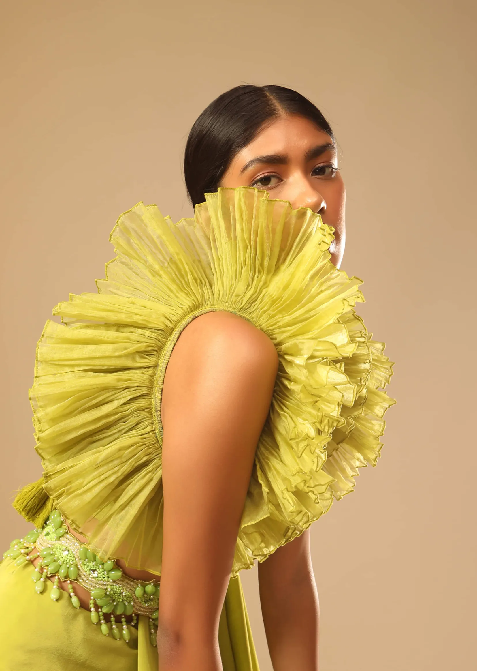 Lime Green Saree In Crepe With Elaborate Ruffle Sleeved Crop Top And Heavy Stone Embroidered Belt