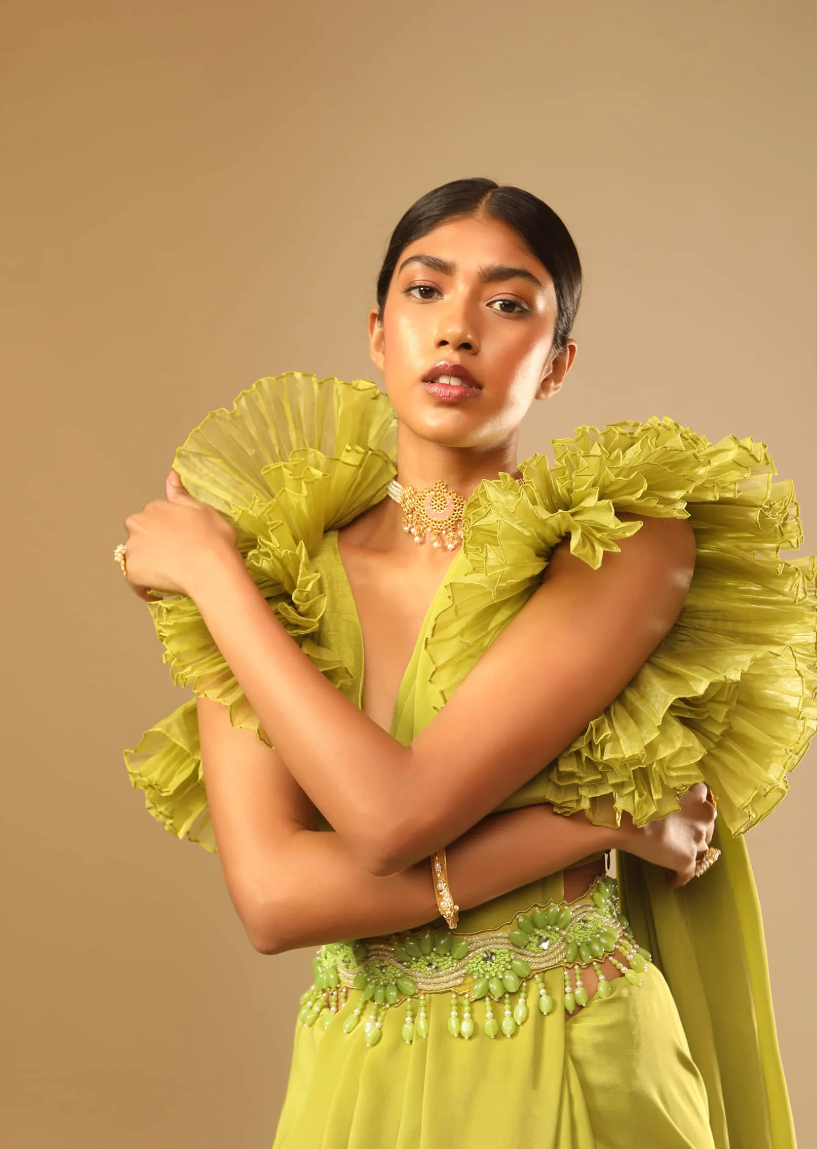 Lime Green Saree In Crepe With Elaborate Ruffle Sleeved Crop Top And Heavy Stone Embroidered Belt