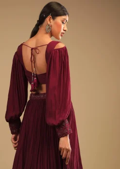 Maroon Lehenga In Crepe With Embroidery Detailing On The Waist And Bishop Sleeved Crop Top