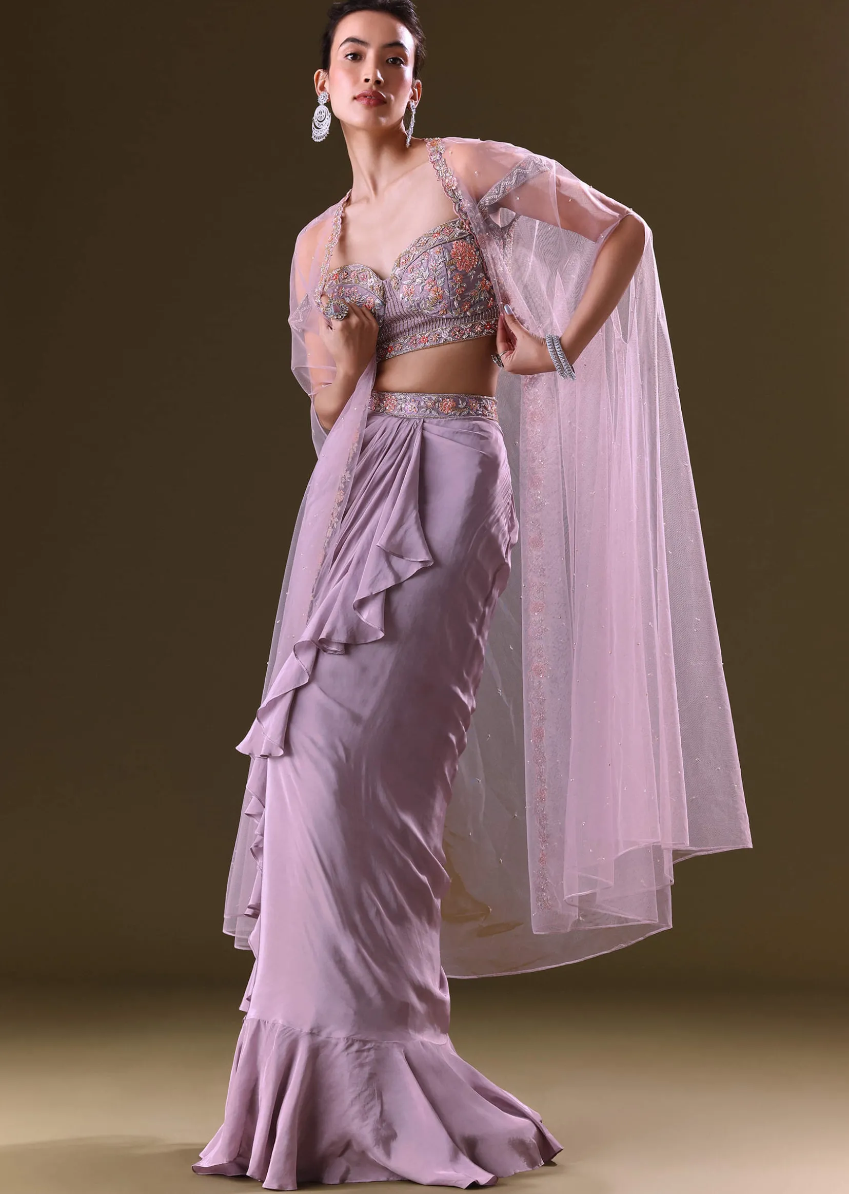 Mauve Ruffled Drape Skirt With Embroidered Blouse And Net Cape