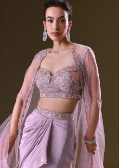 Mauve Ruffled Drape Skirt With Embroidered Blouse And Net Cape