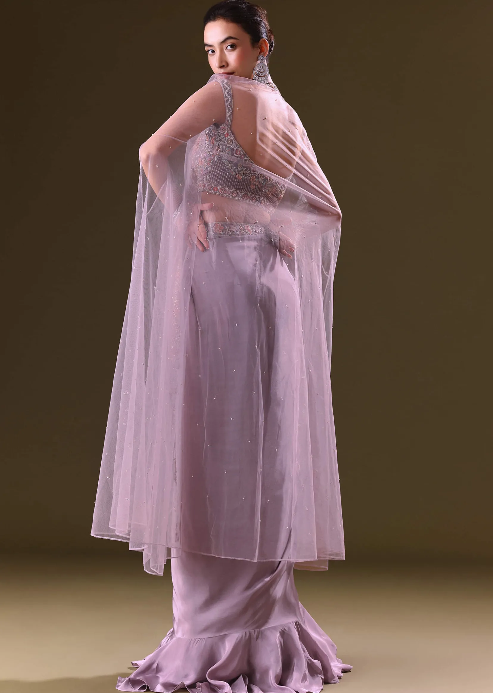 Mauve Ruffled Drape Skirt With Embroidered Blouse And Net Cape