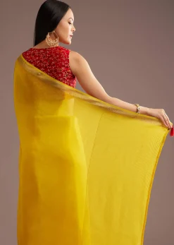 Mustard Yellow Crepe Silk Saree With Zari Border And Contrast Blouse