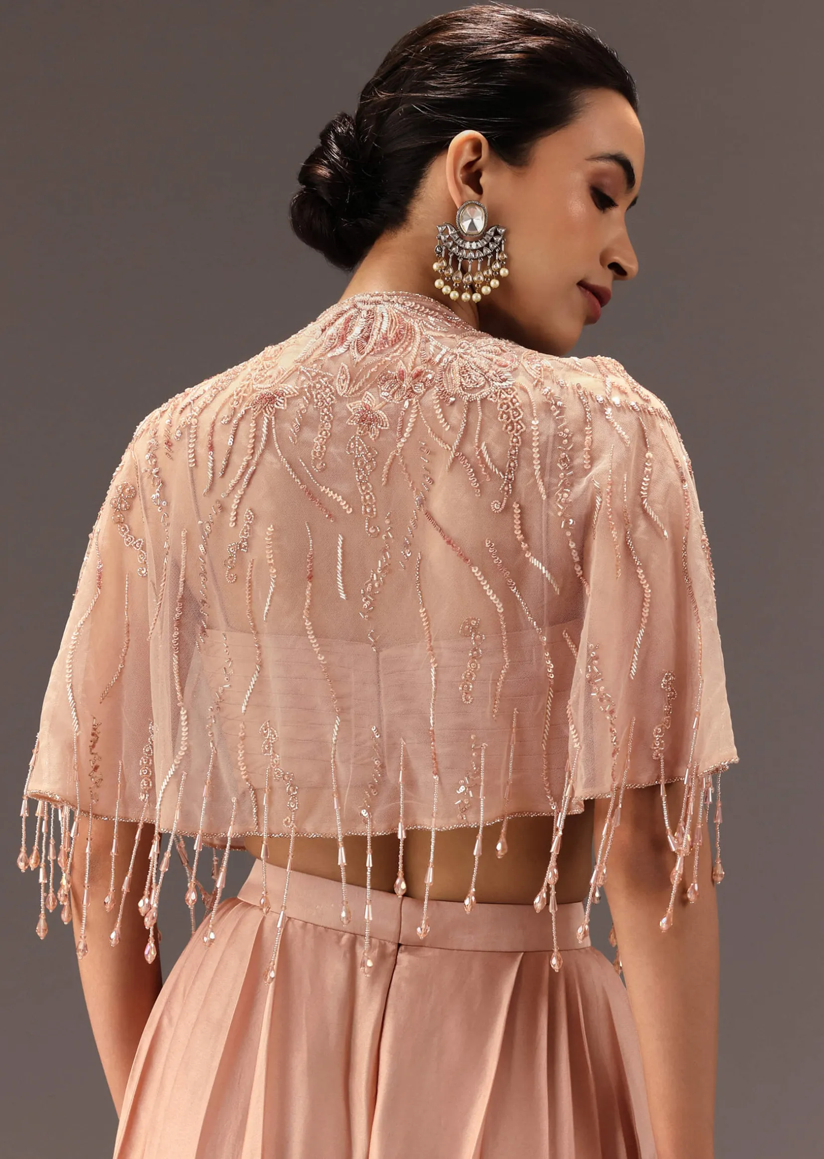 Nude Pleated Blouse With Tassel Cape And Dhoti Pants