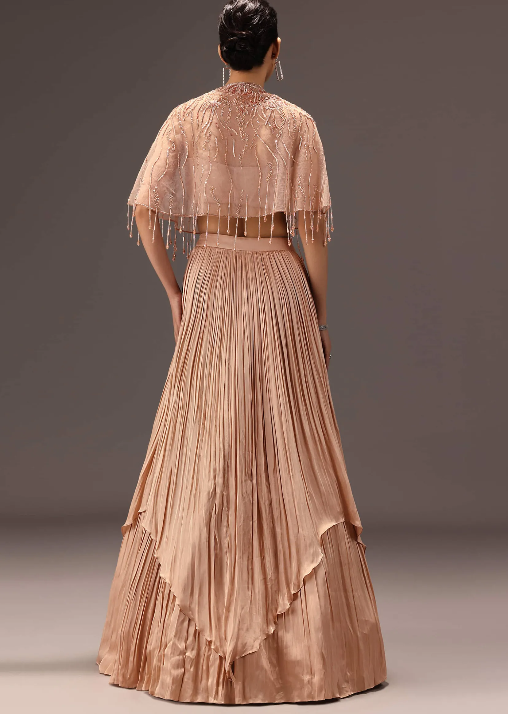 Nude Ruched Blouse With Cape And Layered Skirt