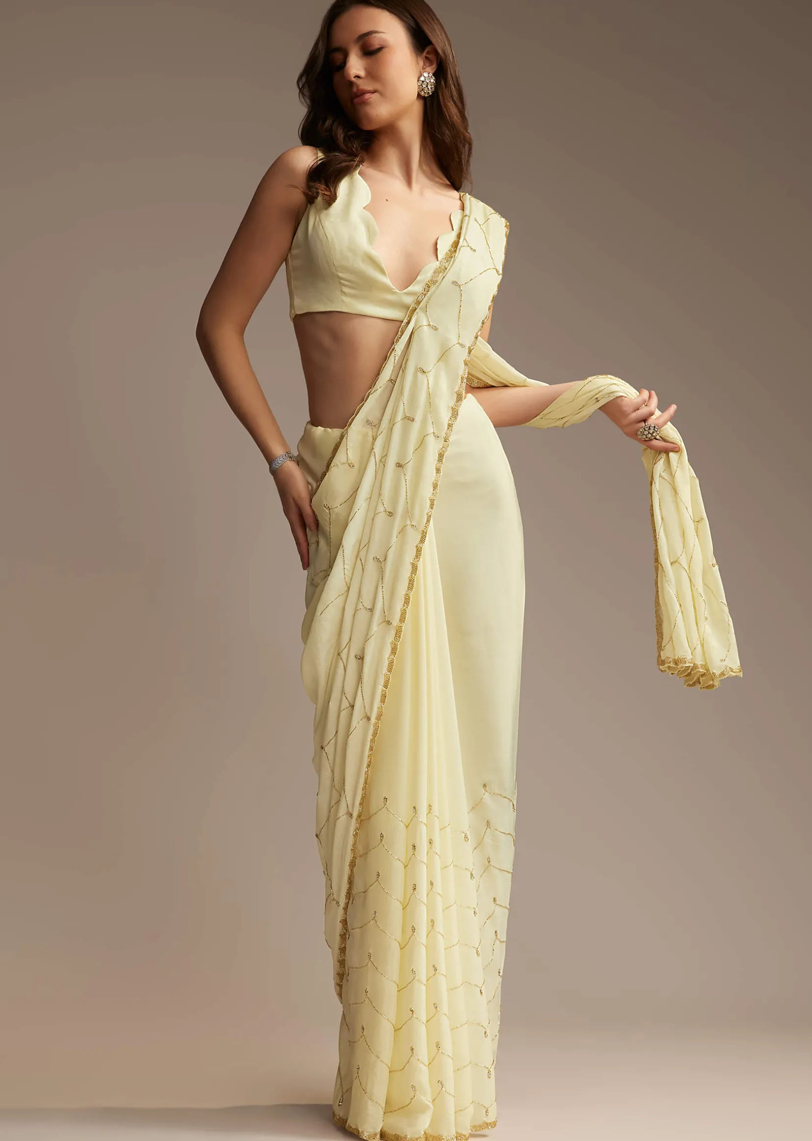 Off White Chinon Saree with Cutdana and Stone Work