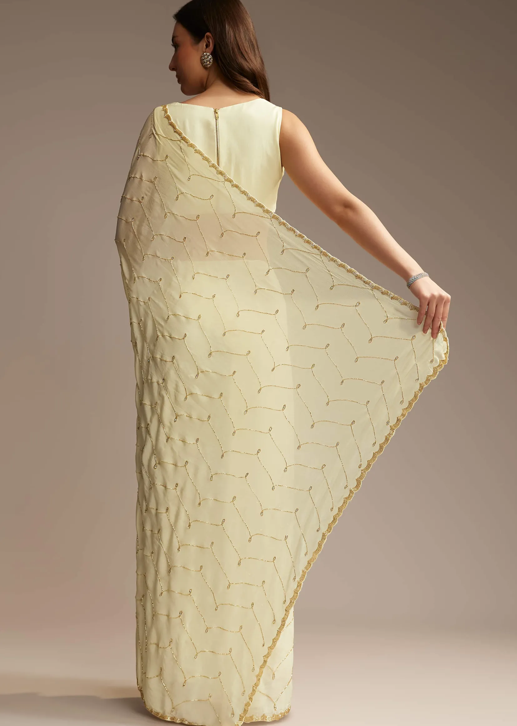 Off White Chinon Saree with Cutdana and Stone Work