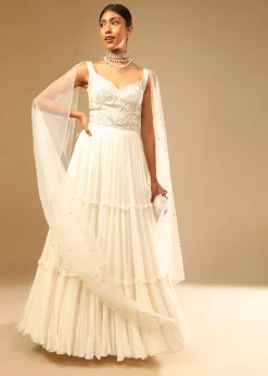 Off White Gown In Georgette With Tiered Flare And Hand Embroidered Leaf Motifs On The Bodice
