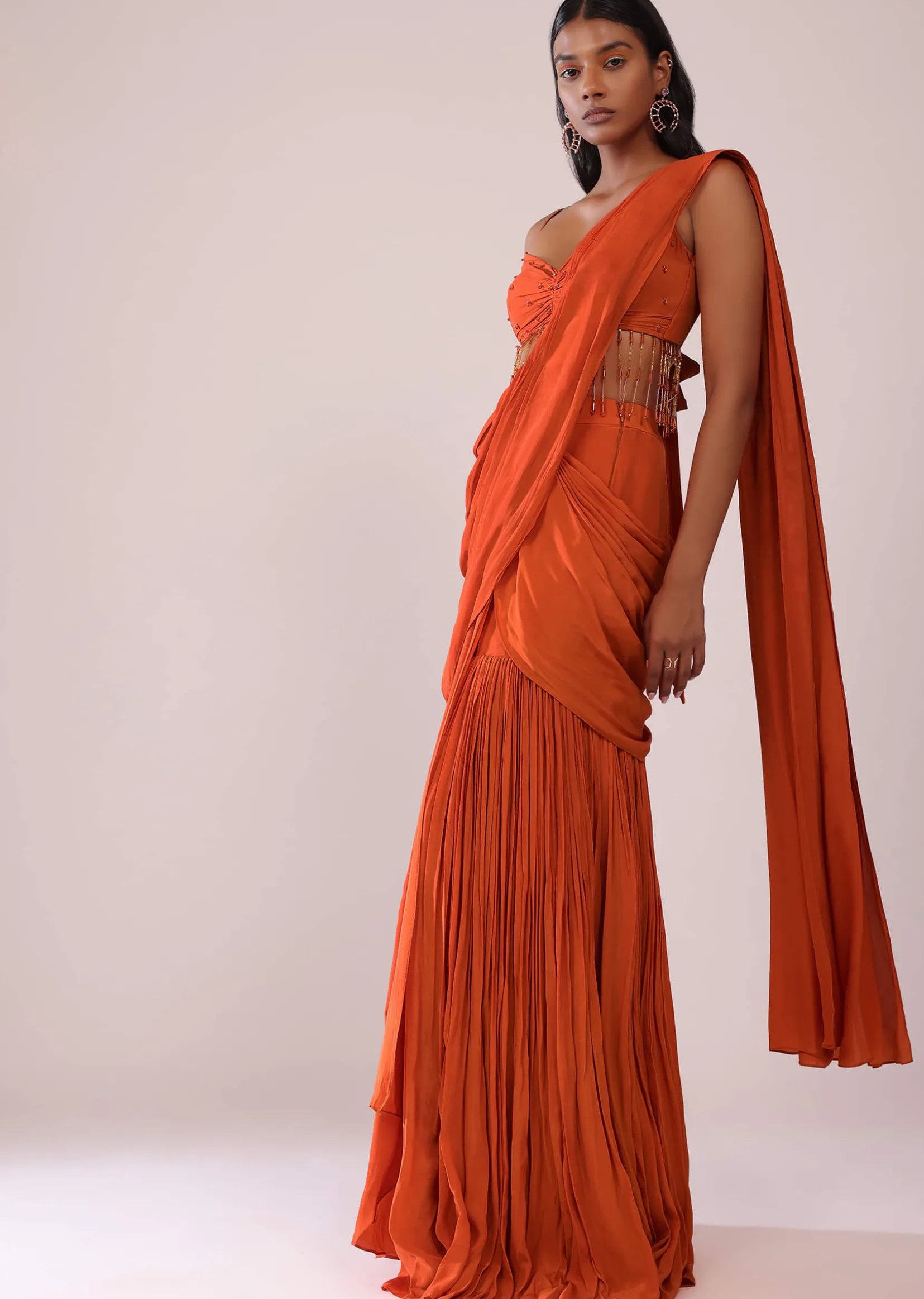 Orange Crepe Drape Saree And Blouse With Crystal Tassels All Over