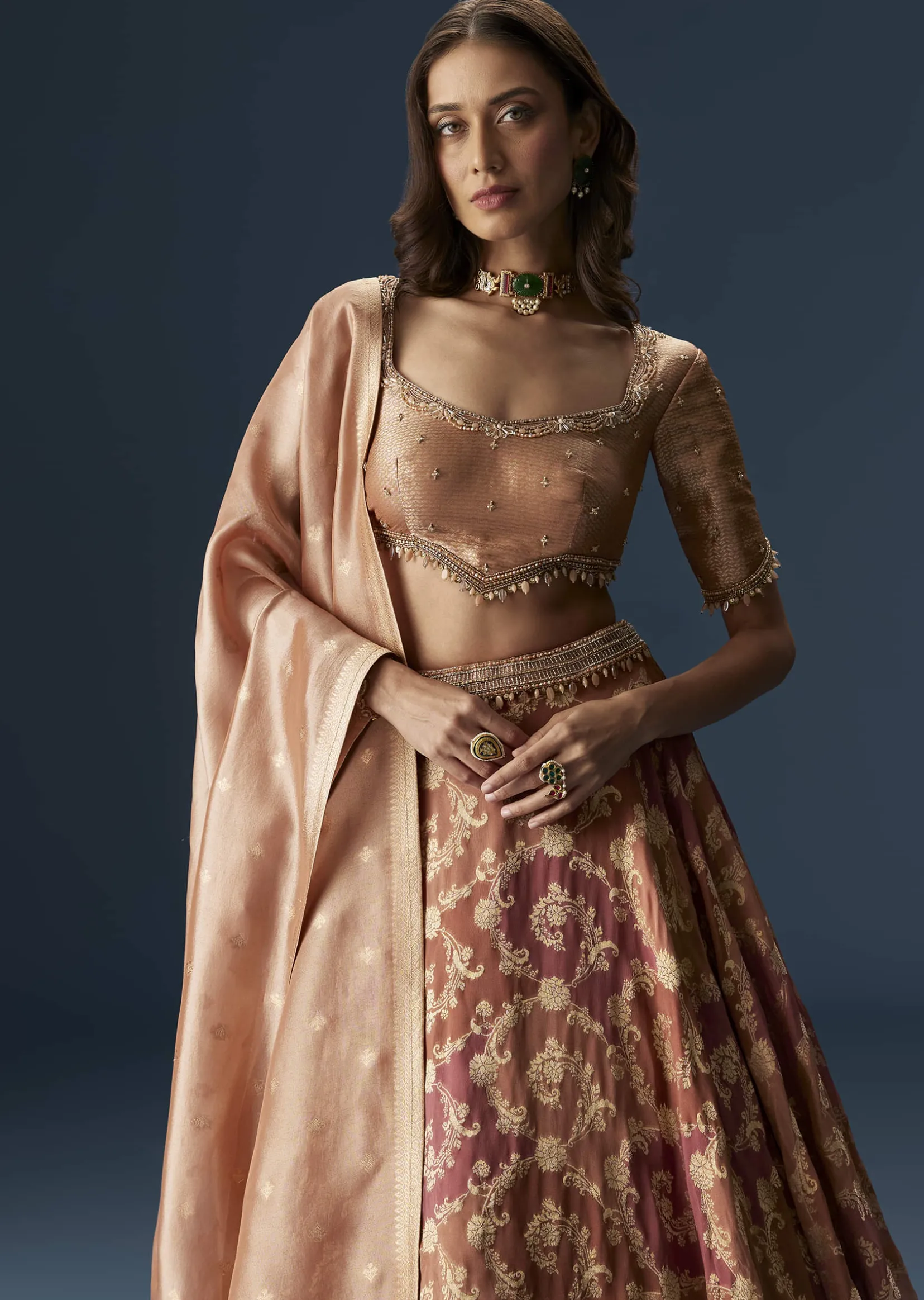 Orange Embroidered Blouse With Ruching Lehenga And Tassel Dupatta