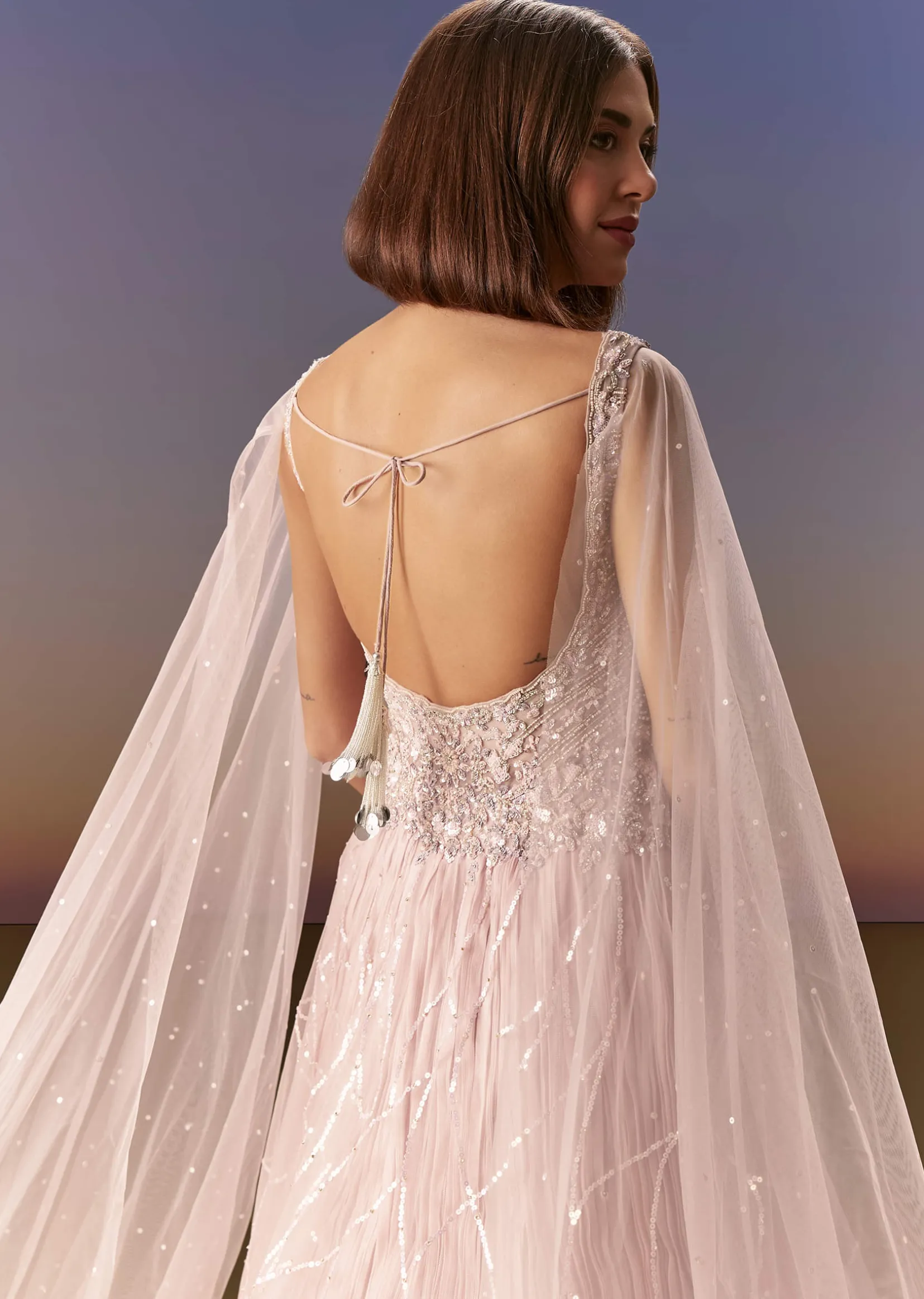 Pastel Pink Gown With Sheer Cape Drape And Heavy Embroidery