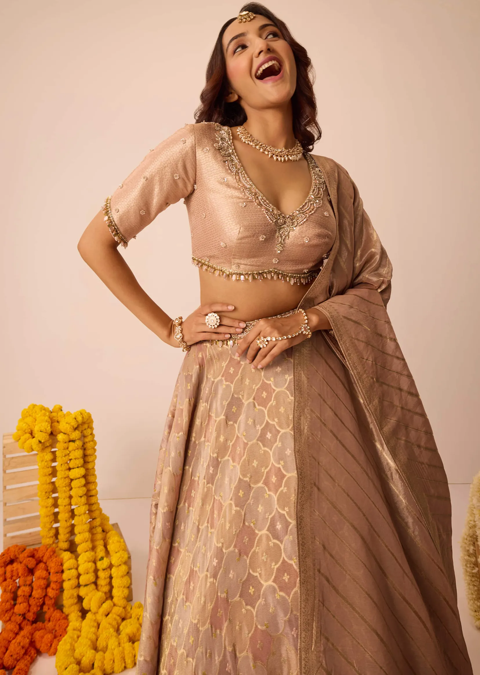 Peach Embroidered Blouse With Ruching Lehenga And Tassel Dupatta