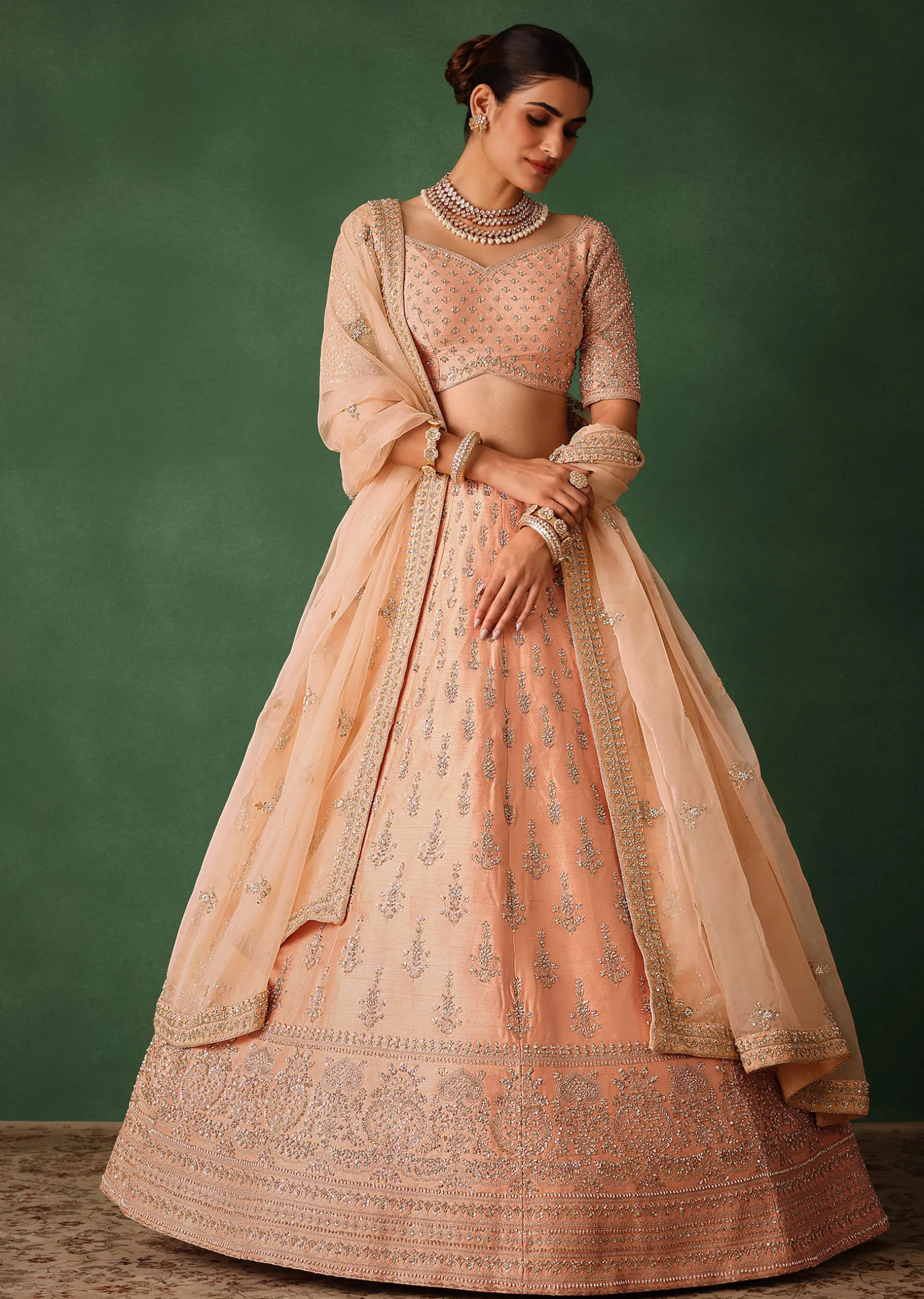 Peach Hand Embroidered Raw Silk Lehenga Set With Butti Work